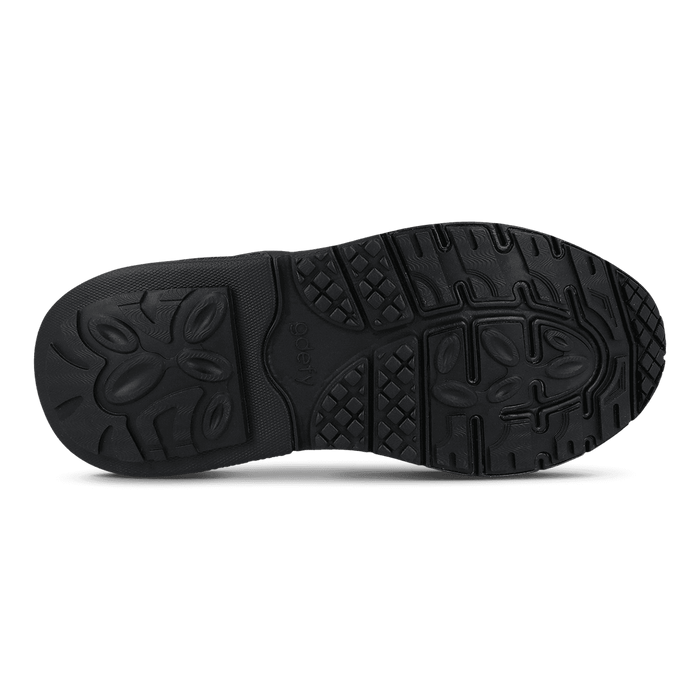 Black sneaker sole with textured tread, featuring "go defy" logo and various grip patterns for traction.