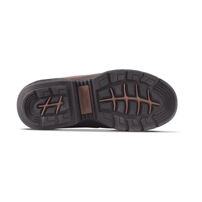 Bottom of a brown work boot with a dark brown slip-resisting and oil-resisting sole, featuring Versoshock Gravity Defyer bran