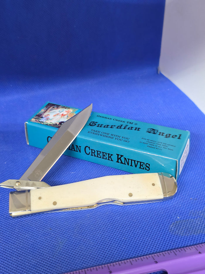 Guardian Angel Lock Back Cheetah Knife White Bone Handles 4 3/8" EM2567052WBN