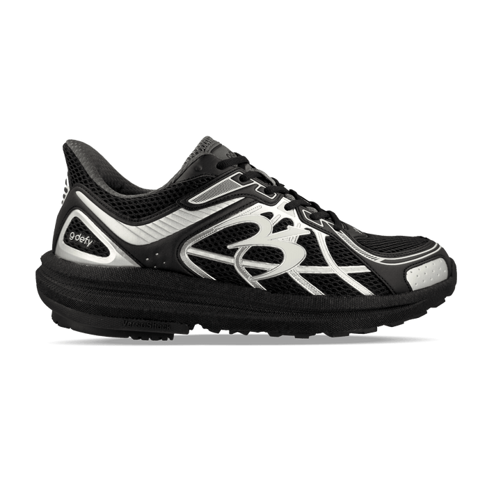 Black running shoe with silver accents, mesh upper, and a chunky textured sole, featuring a large silver logo on the side.