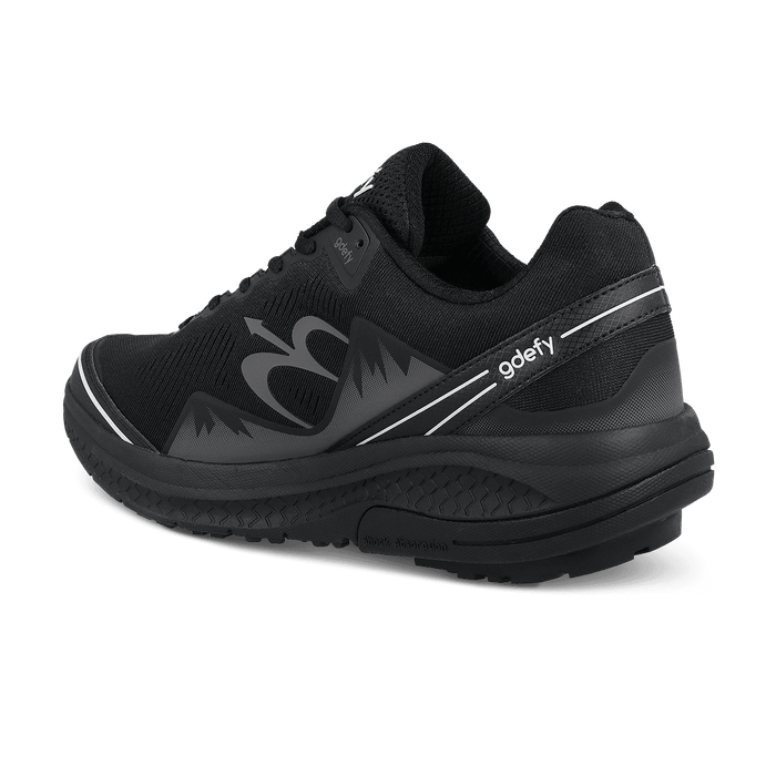 Black running shoe with mesh upper, white stripes, and "gdefy" logo, shown from a back angle. Thick shock absorption sole.