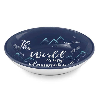 A round shallow bowl with a dark navy blue interior featuring the phrase 'the World is my playground' in white script, decorated with white and light blue mountain illustrations. The exterior of the bowl is white, shown against a plain white background.