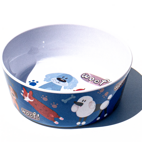 Dog bowl with cartoon designs and 'woof!' text on a white background